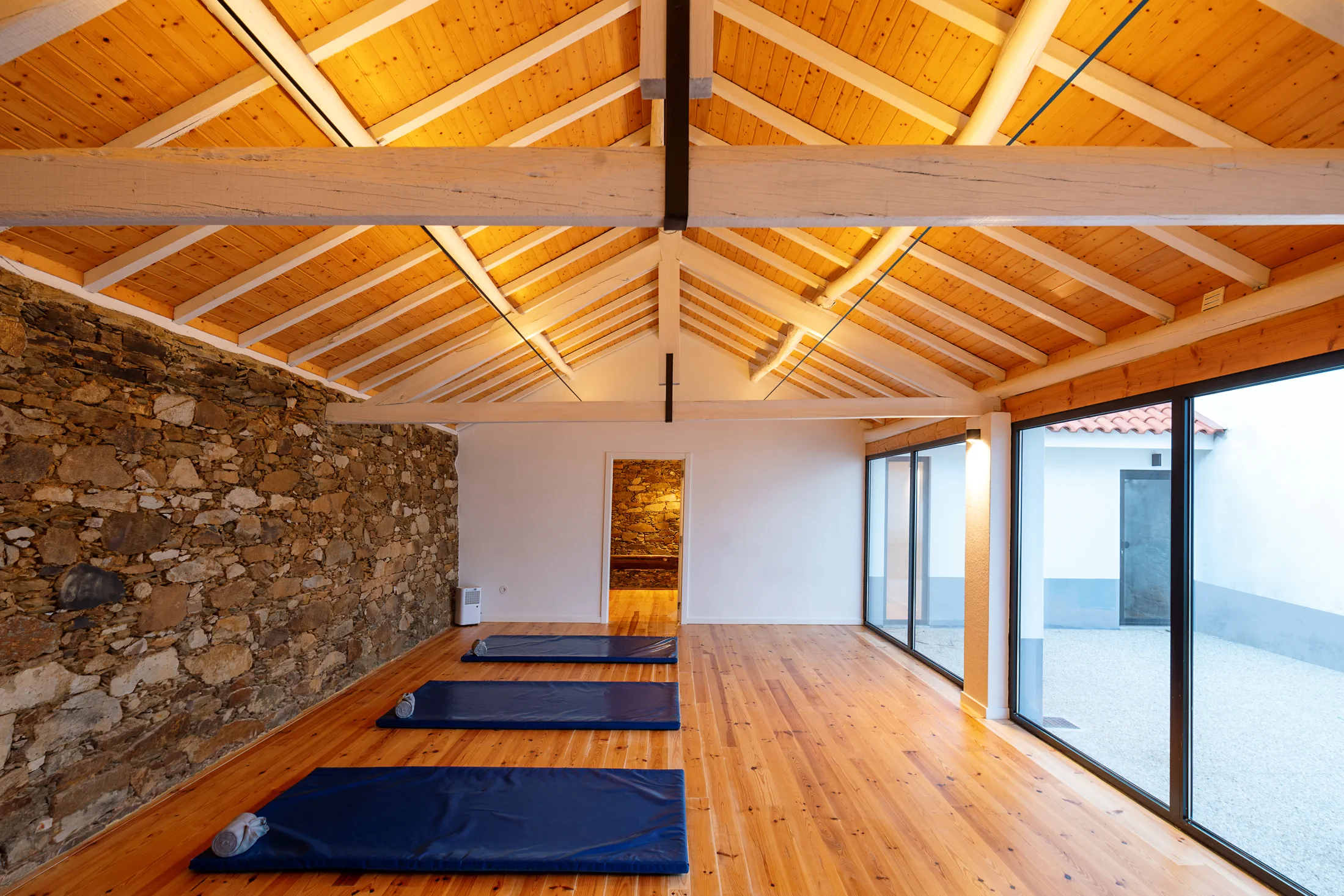 Yoga studio with soft light and timber floors at Quinta Chaouen
